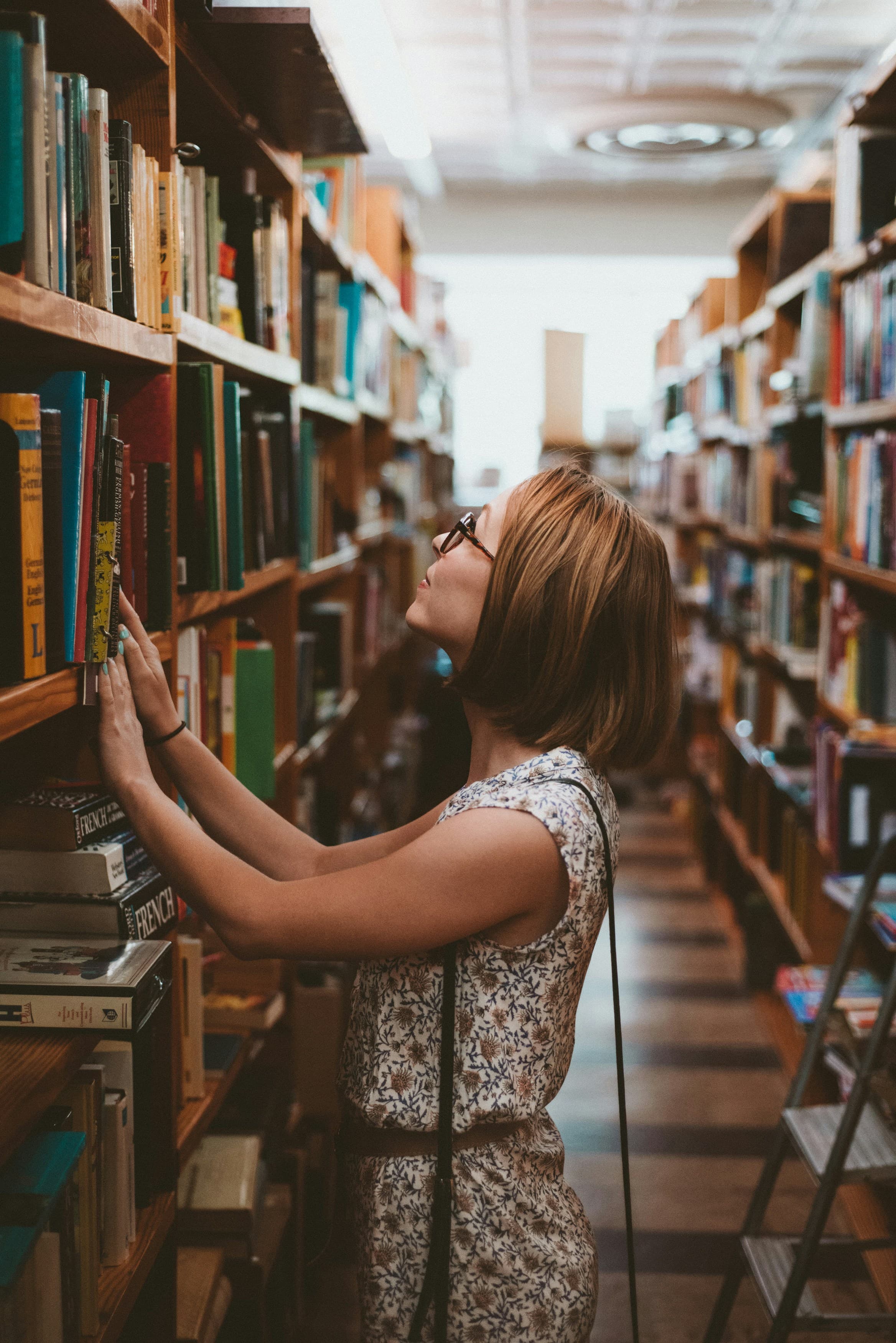 A learner studying in a library