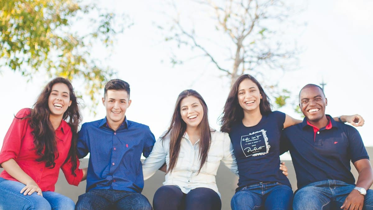 A group of smiling students sitting together