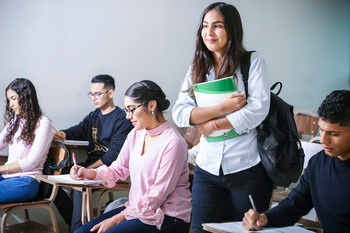 Young students taking notes in a classroom