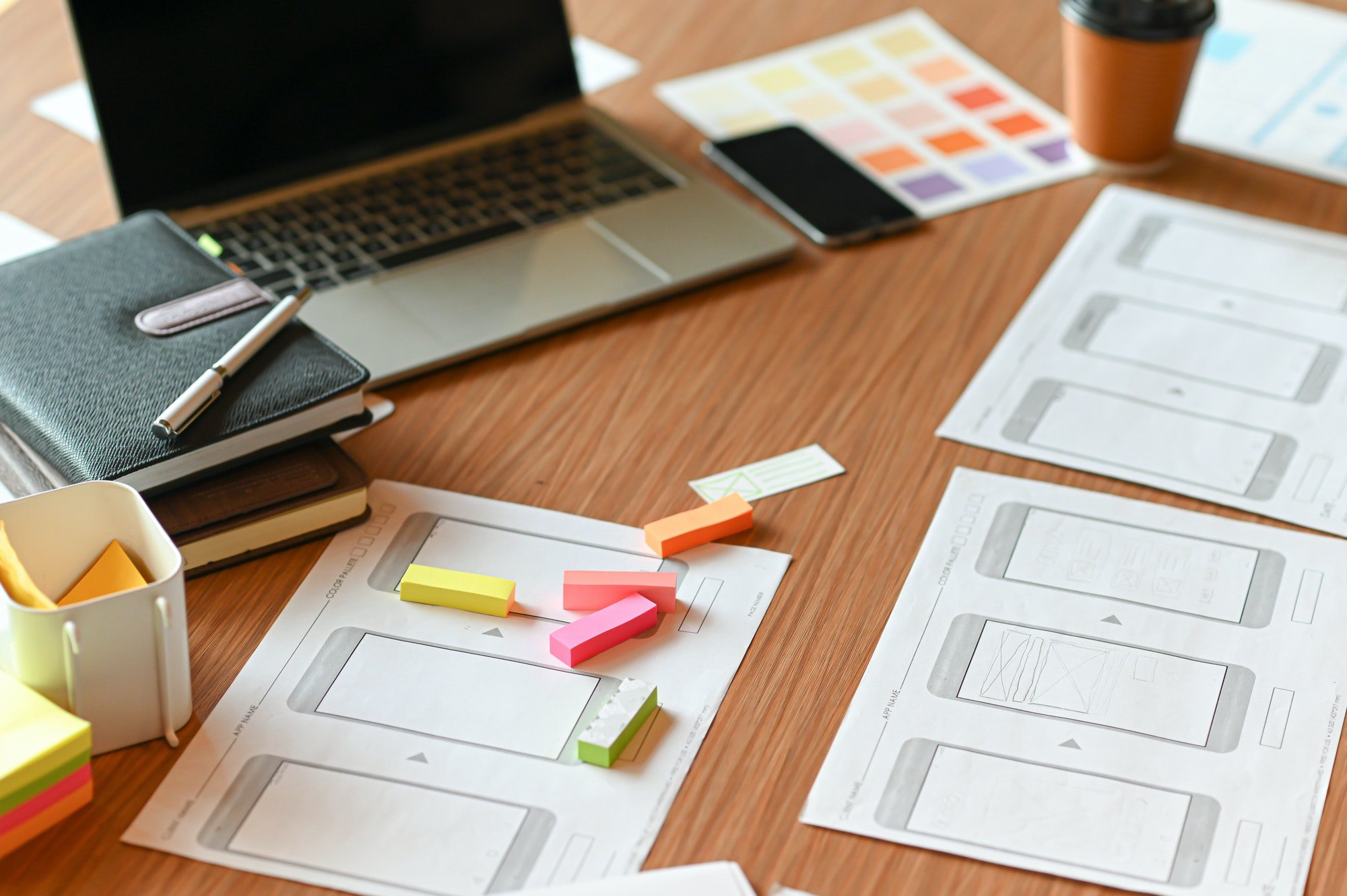 designer desk space for designers color charts model phones and tablet